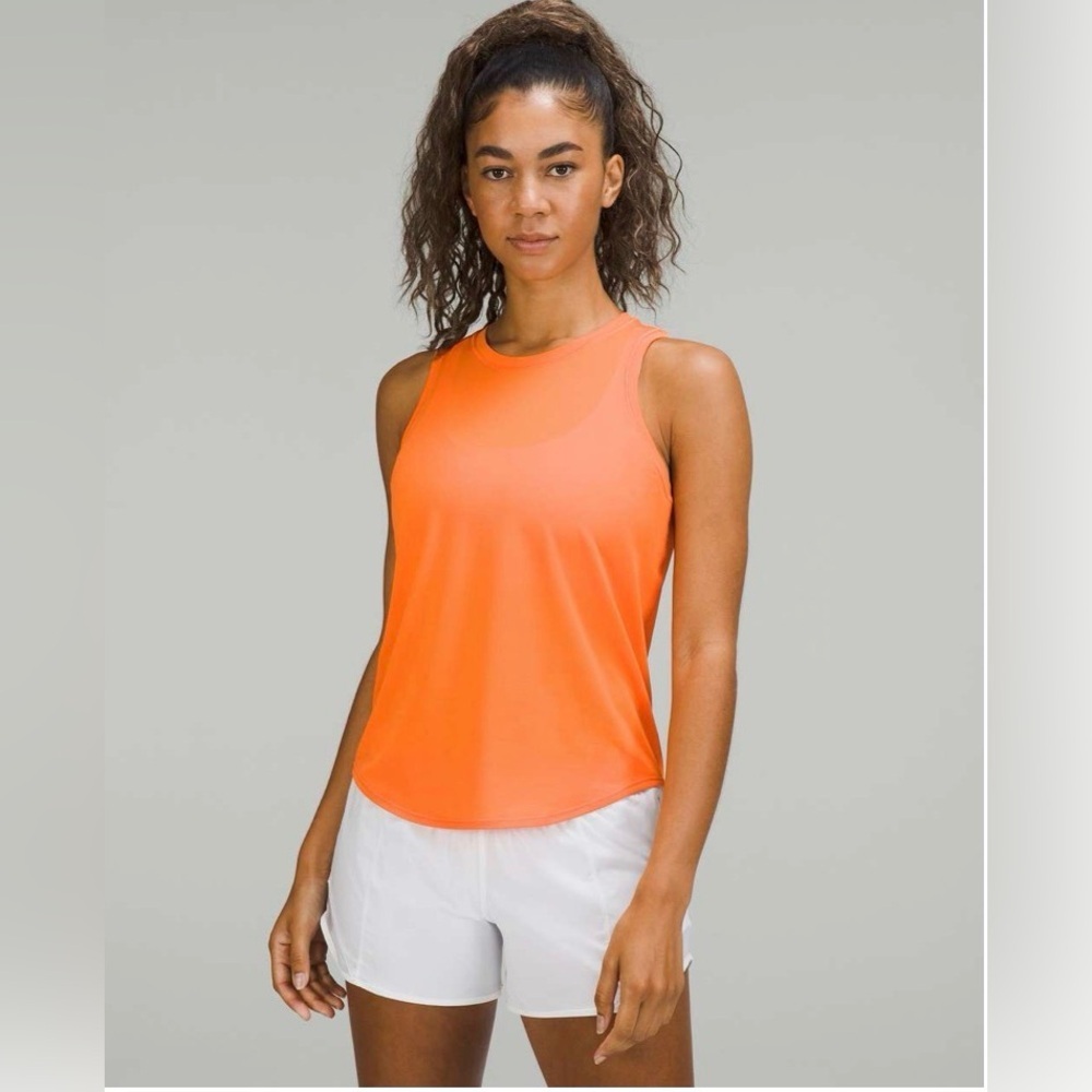 Lululemon High-Neck Running and Training Tank Top in
Orange Frappe